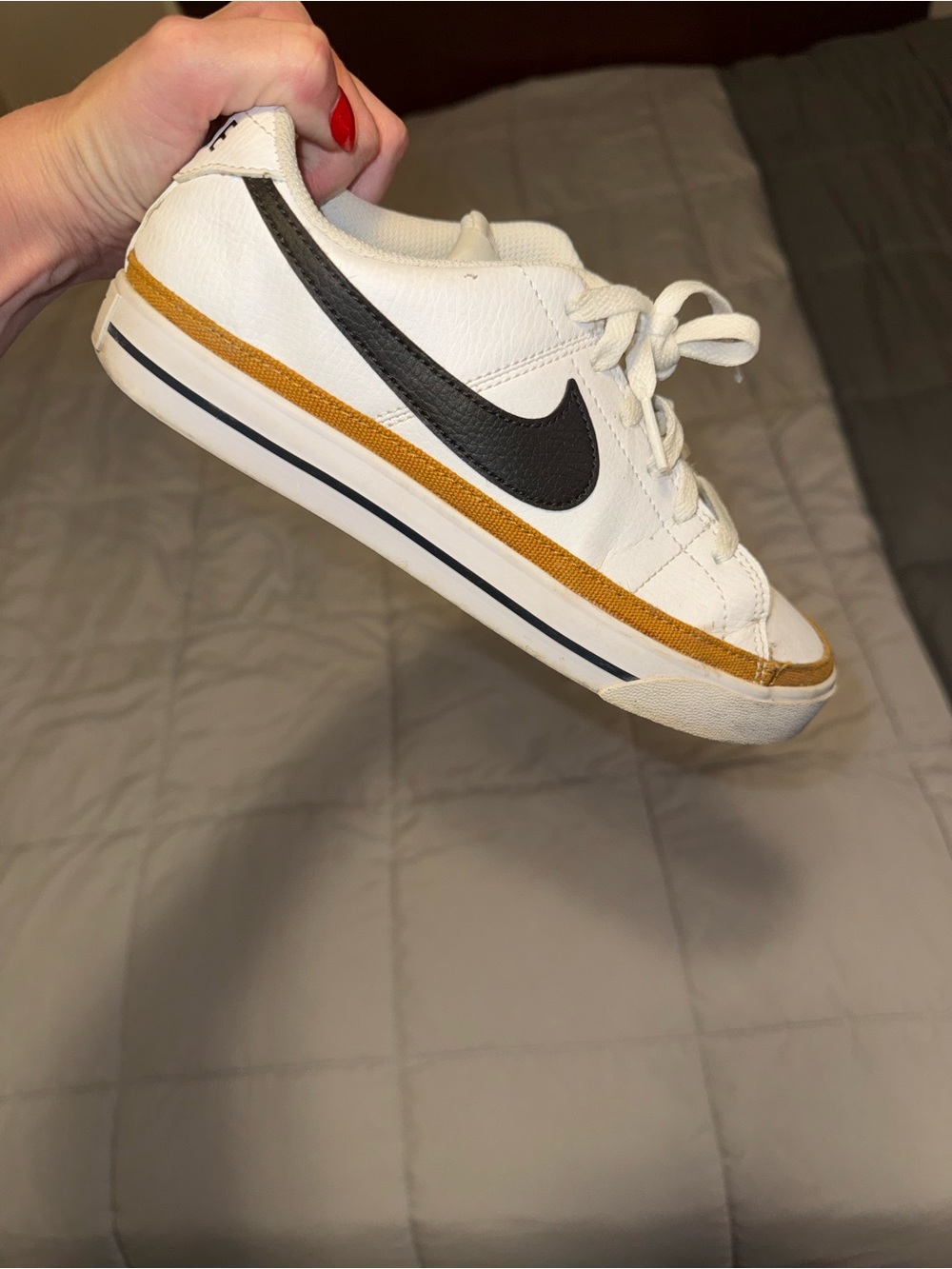 Nike White Leather Sneaker with Black Swoosh and Mustard Stripe